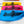 Boat fender covers with pink, blue and yellow backgrounds and NautiCovers branded logo